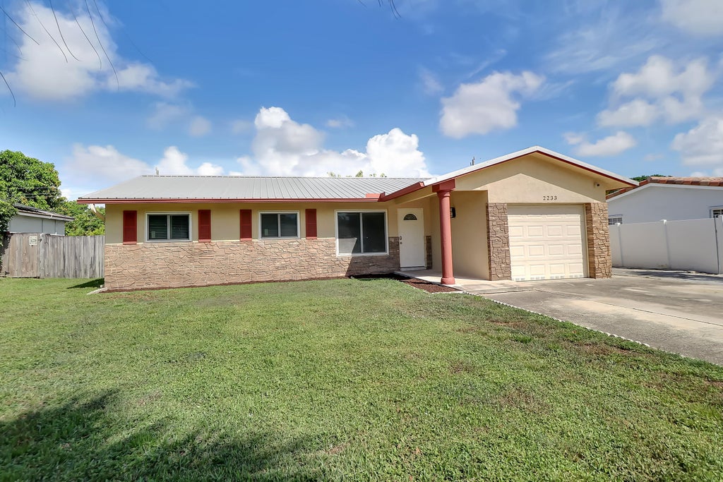 Photo of 2233 NW 3RD Avenue, Boca Raton, FL 33431 (MLS # B26075741)