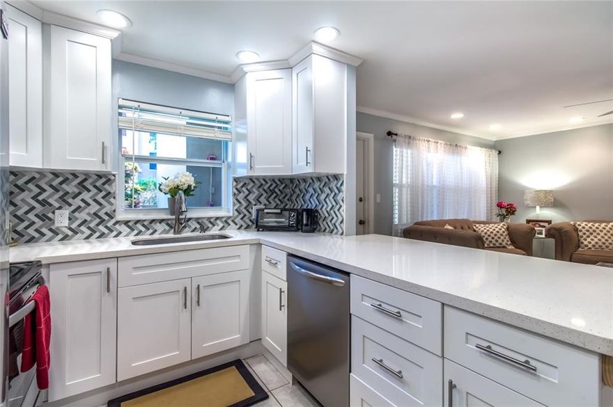 AMAZING FIRST FLOOR CONDO JUST STEPS FROM THE WATER, POOL AND BBQ GRILLS. VERY QUIET AND PRIVATE UNIT. BEAUTIFUL BRAND NEW KITCHEN, NEW STAINLESS STEEL APPLIANCES, NEW QUARTZ COUNTER TOPS. MOVE RIGHT IN. LARGE SPACIOUS ROOMS WALK IN CLOSET. ALL IMPACT WINDOWS. LESS THAN 5 MINUTES WALK TO THE BEACH AND RESTAURANTS. AMENITIES INCLUDE HEATED POOL BY THE INTRACOASTAL, BB-Q CLUBHOUSE, PICNIC AREA AND SMALL GYM. BOAT SLIP WHEN AVAILABLE. NO FIXED BRIDGES.  PETS WELCOME.INSIDE PICTURES WILL BE LOADED IN 24HRS