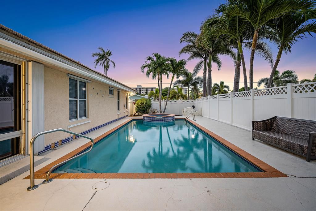 Photo of 201 Cascade Lane Ln, Palm Beach Shores, FL 33404 (MLS # R10719900)