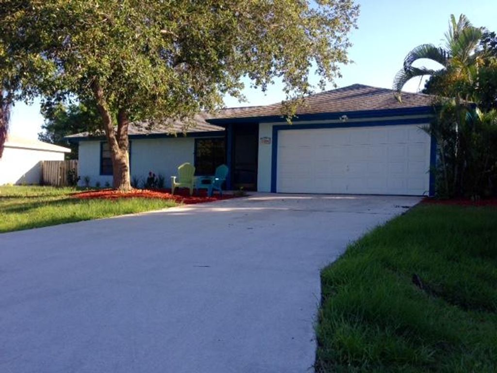 Photo of 2208 SE Trillo Street, Port Saint Lucie, FL 34952 (MLS # R11066905)