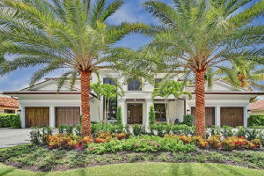 Spectacular, new construction waterfront home in Royal Palm Yacht & Country Club on 100ft of waterfront of an interior canal with direct Intracoastal and Ocean access. Built by Mark Timothy Luxury Homes, Inc., and interior designed and furnished by Marc Michaels Interior Design Inc., this home is built with high-end construction upgrades including concrete second floor and concrete pilings. Luxury living at its finest with grand foyer entry with mahogany front door, stone and wide-plank wood flooring throughout all main living areas, high ceilings, custom trim and moldings throughout, formal living room with fireplace and boutique entertaining bar, formal dining room and wine room, club room with media lounge, Irish pub bar and sliding glass doors leading to a covered exterior lounge area, private library/study, spacious open gourmet kitchen with stone countertops and custom wood cabinetry, large center work island with vegetable sink, breakfast bar, upgraded built-in appliances and custom wood cabinetry with walk-in pantry. Large family room with breakfast area opening to a covered loggia area, perfect for entertaining. To complete the first floor, there is a guest suite and laundry room with access to the garage and dog washing station. Take the elevator or custom designed staircase to the second floor loft area with laundry room, 4 bedrooms, all with en suite bathrooms and walk-in closets. Spacious second floor master suite with morning bar and private sitting area, sliding glass doors leading out to a private balcony overlooking the waterway, elegant his and her bathrooms, hers with stone tops, custom built-in cabinetry, stone flooring, spa tub, separate shower and private water closet, his with walk-in shower. Custom his and her walk-in closets with custom wood built-in shelving, drawers and marble countertops, her closet with center island storage and sitting space, and an additional, separate seasonal closet. Exterior features include private dock, stone walkways and front circular driveway with 4 car garage plus golf cart, impact glass windows and doors, heated salt water pool and spa, covered loggia with summer kitchen, bar area and fireplace, outdoor shower, multi-zone high efficiently A/Cs with programmable thermostats, natural gas, energy smart upgraded Icynene insulation, full house generator and Crestron home automation system with smartphone interface. This home is a unique, one-of-a-kind home and the best Royal Palm has to offer! Buyer to pay documentary stamp taxes on the deed and title insurance. Home is complete, ready for occupancy and being sold fully furnished/turnkey.