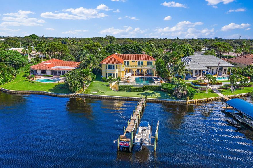 It is hard to know where to begin on this incredible estate. Best value on river in a long time. 
110 feet on the Loxahatchee River with the widest water views and 100 ft long dock. This home is large and spacious and all rooms are over sized. 6 bedrooms, 6 1/2 baths PLUS a live in suite for help/nanny/family in a separate wing.  Open floor plan woth gorgeous kitchen and family room opening up to one of the nicest pool/spa area sitting on high elevation overlooking the river for absolutely stunning sunsets. Impact doors and windows, hardwood floors, large man cave/library, master bedroom off the charts overlooking river with balcony, elevator, sauna, whole house generator, putting green , one of the great banyan trees in the area. No fixed bridges for quick access to the ocean. Must See!!