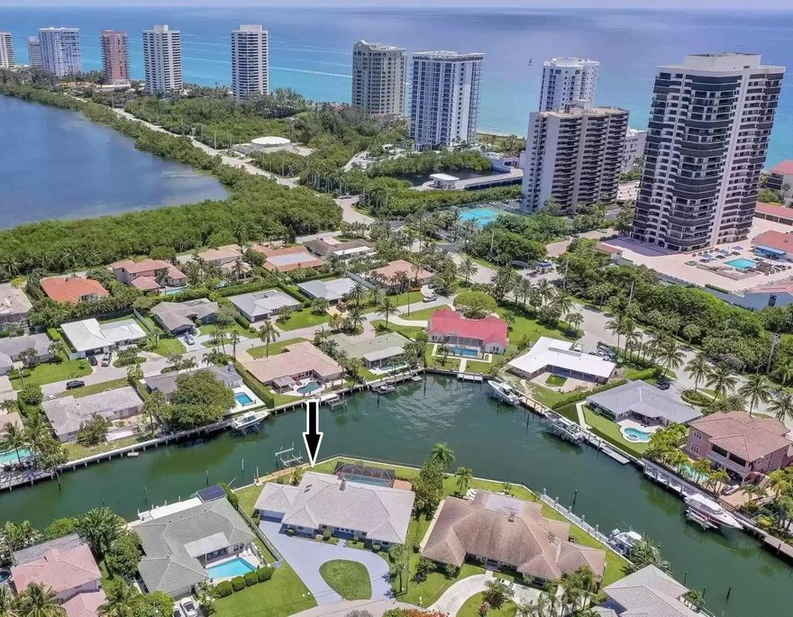 GORGEOUS SPACIOUS WATERFRONT HOME ON HUGE CORNER LOT ON BEAUTIFUL SINGER ISLAND........BOAT DOCKAGE - NO FIXED BRIDGES - DIRECT OCEAN ACCESS - SEAWALL Approx 175 Ft - PLUS DEEP WATER CANAL ........ALL SPLIT BEDROOMS w/ PRIVATE BATHS........SCREENED IN VERY HUGE POOL AND PATIO W/ OVERHANGING ROOF........MARBLE FLOORING THROUGHOUT LIVING & DINING ROOM AREAS, WHICH IS FABULOUS FOR INDOOR/OUTDOOR ENTERTAINING........Newly painted driveway and ext of home ........Beach Access .....