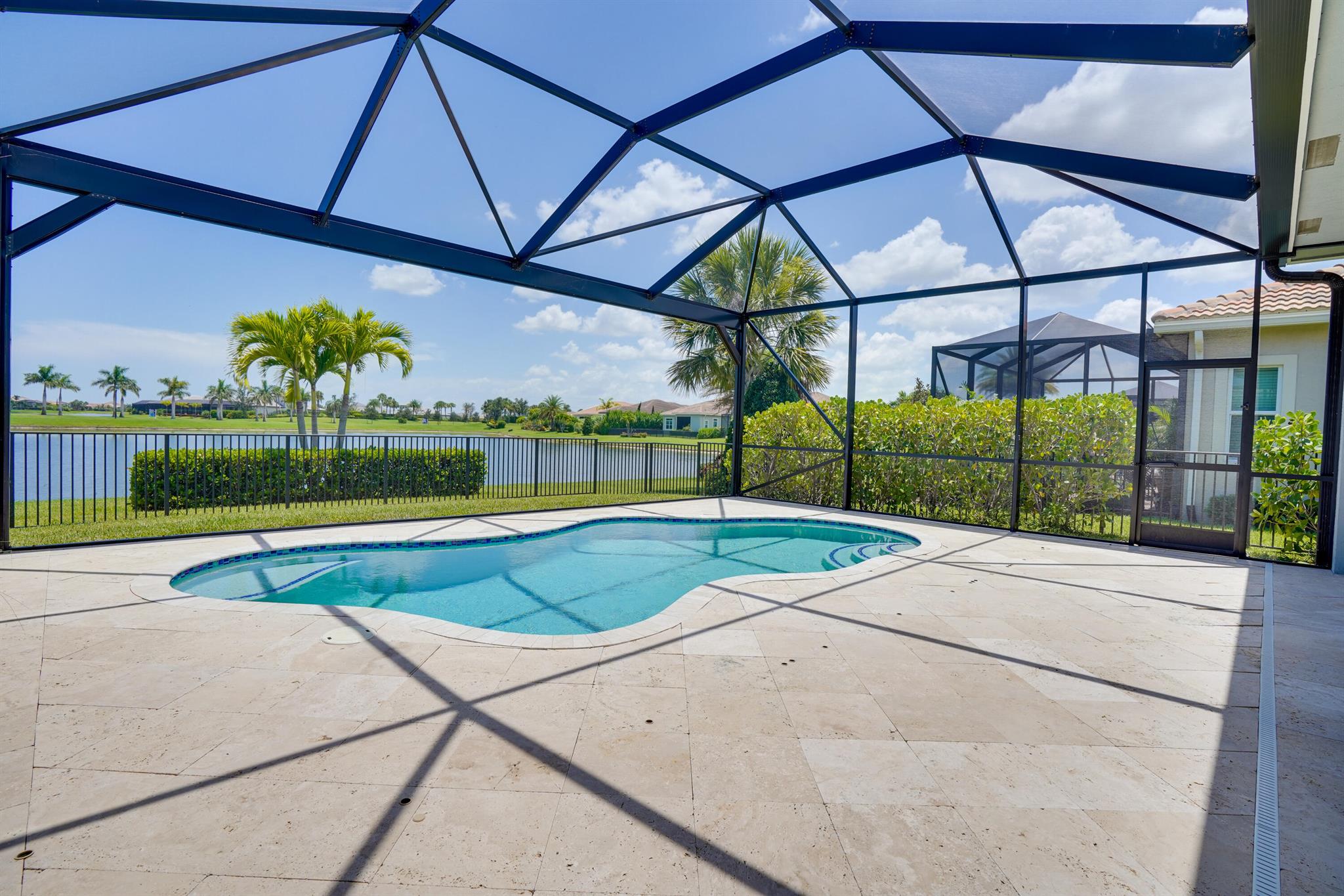 Stunning lake view property situated on one of Verano's most desirable lots. Enjoy breathtaking views from the picture frame screen enclosure, perfectly framing the water. This home boasts luxurious upgrades, including luxury vinyl flooring throughout, plantation shutters, and a stylish kitchen backsplash. Additional features include tray ceilings in the living room and owner's bedroom, a spacious walk-in pantry, and travertine tile on the pool deck. The expansive pool area is perfect for relaxation, and the fenced yard is ideal for pets. No homes behind, providing serene views and tranquility. PGA golf memberships are available for purchase, but not required to join. Verano has many resort amenities which are included in your monthly fee. Lawn care, cable and internet are also include.