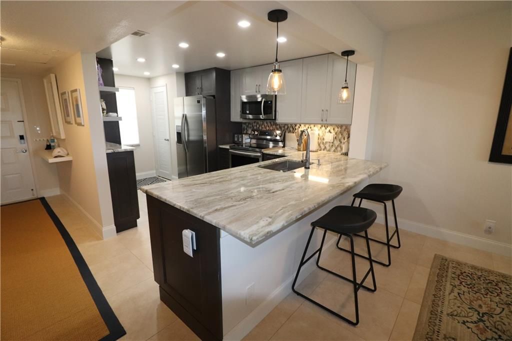 Photo of 3520 Oaks Way #705, Pompano Beach, FL 33069 (MLS # F10285155)