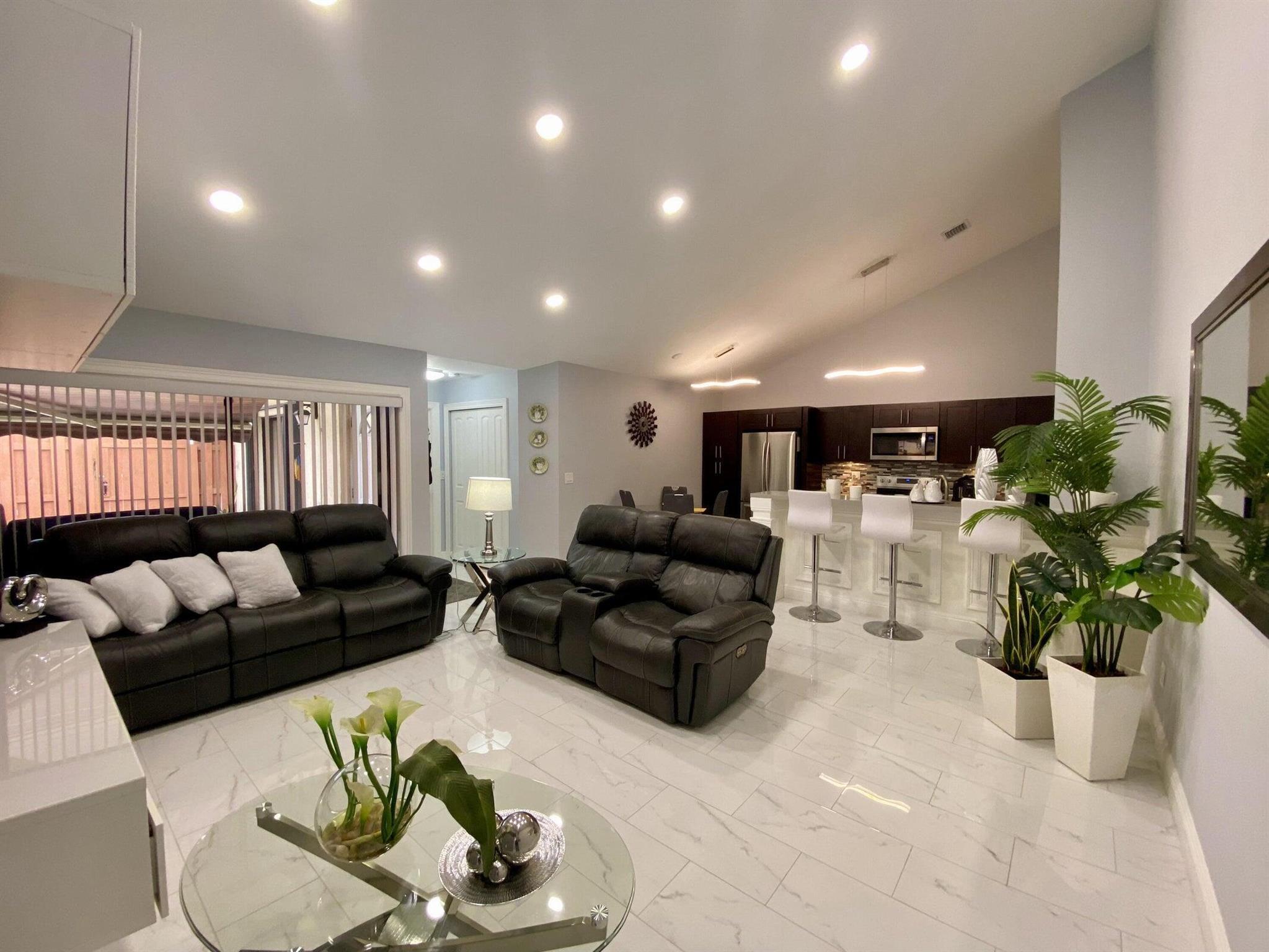 Welcome to your dream home! This immaculate 3-bed, 2-bath villa is a haven of luxury and convenience. Step inside to discover a seamless blend of elegance and comfort, featuring gleaming tile floors, high ceilings, and an open floor plan. The upgraded kitchen is a chef's delight with stainless steel appliances, granite countertops, and custom cabinetry. The master suite offers a tranquil retreat with its own en-suite bathroom and ample closet space. Two additional bedrooms provide versatility for a home office or guest room. The private patio is perfect for morning coffee or entertaining under the stars. Centrally located, this villa is a stone's throw away from shopping, entertainment, major highways, and the airport. Don't miss out! schedule your showing today!
