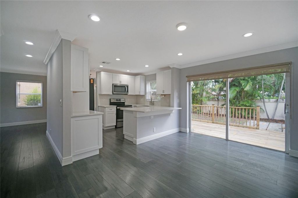 Photo of 18 NW 43rd Way, Deerfield Beach, FL 33442 (MLS # F10519569)