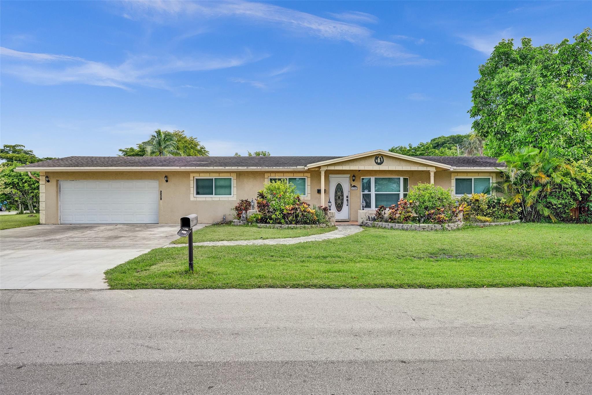 Charming 4-Bedroom, 2-Bathroom Single-Family Home with Spacious Driveway. Move-in ready and waiting for you! This beautifully maintained home offers hurricane-impact windows and doors for peace of mind, a dedicated utility/laundry room, and a private backyard filled with lush fruit trees—perfect for relaxation and gatherings. The expansive driveway easily fits 6+ vehicles, ideal for families or entertaining guests. Conveniently located near schools, shopping, and major highways. Schedule your private tour today!