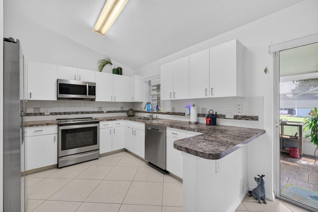 Photo of 1060 NW Tuscany Drive, Port Saint Lucie, FL 34986 (MLS # B26082341)