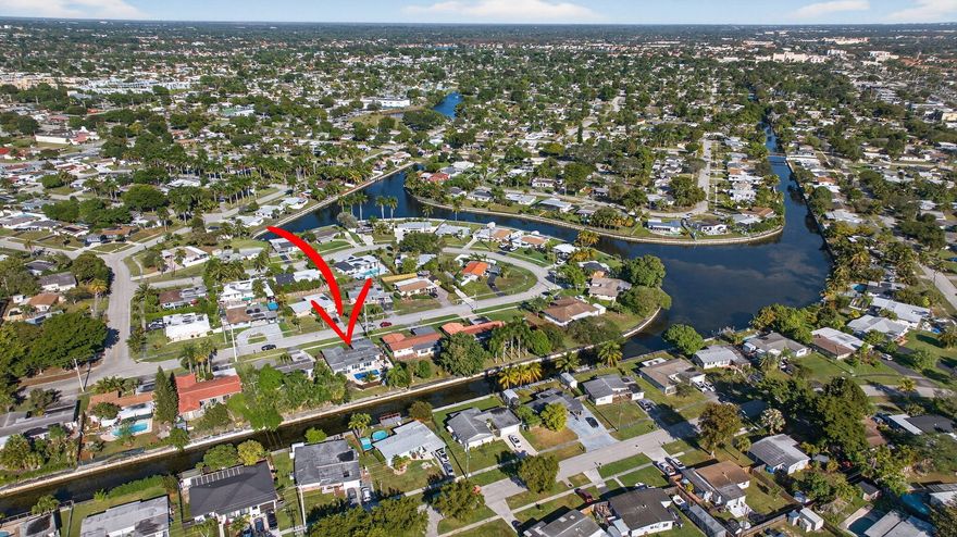 Waterfront Florida ranch on the navigable Stranahan River with solid concrete seawall, saltwater heated pool and spa, boat ramp, and NO HOA! 2018 roof, all impact windows and doors, and tile throughout offer peace of mind. Inside, an open-concept layout centers on a designer kitchen with quartz countertops, peninsula seating, stainless steel appliances, coffee bar, and statement farmhouse sink. Both bathrooms are fully renovated with frameless glass showers and spa style finishes. Multiple outdoor living spaces include a travertine pool deck and tranquil front courtyard, all tucked behind a custom privacy wall that creates a true waterfront retreat! Waterfront pool home on the navigable Stranahan River offering approximately 75 feet of water frontage, a solid concrete seawall, and no HOA. This updated single-story residence features a flexible 2-bedroom plus den layout, with the den easily functioning as a third bedroom, guest space, or home office with direct access to the backyard. Designed for privacy and indoor-outdoor living, the property includes a tranquil front zen courtyard and a spacious travertine paver patio surrounding a private saltwater heated pool and spa with Pentair automation. A custom privacy wall enhances the backyard experience by shielding the main entertaining areas while maintaining open waterfront views. The interior offers an open-concept layout with a renovated kitchen featuring quartz countertops, peninsula seating, white cabinetry, open shelving, stainless steel appliances, a farmhouse sink, and dedicated coffee bar. Both bathrooms have been fully updated with frameless glass walk-in showers, rainfall fixtures, and modern tile finishes. Additional improvements include a 2018 roof, full impact windows and doors, tile flooring throughout, and mature landscaping. Navigable water access supports boating, jet skis, kayaking, and paddleboarding directly from the property. Well-suited for buyers seeking waterfront living with flexible space and strong value in the area.