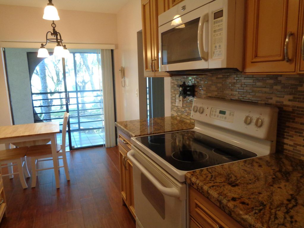 Photo of 6328 W Longboat Ln #201, Boca Raton, FL 33433 (MLS # B26024047)
