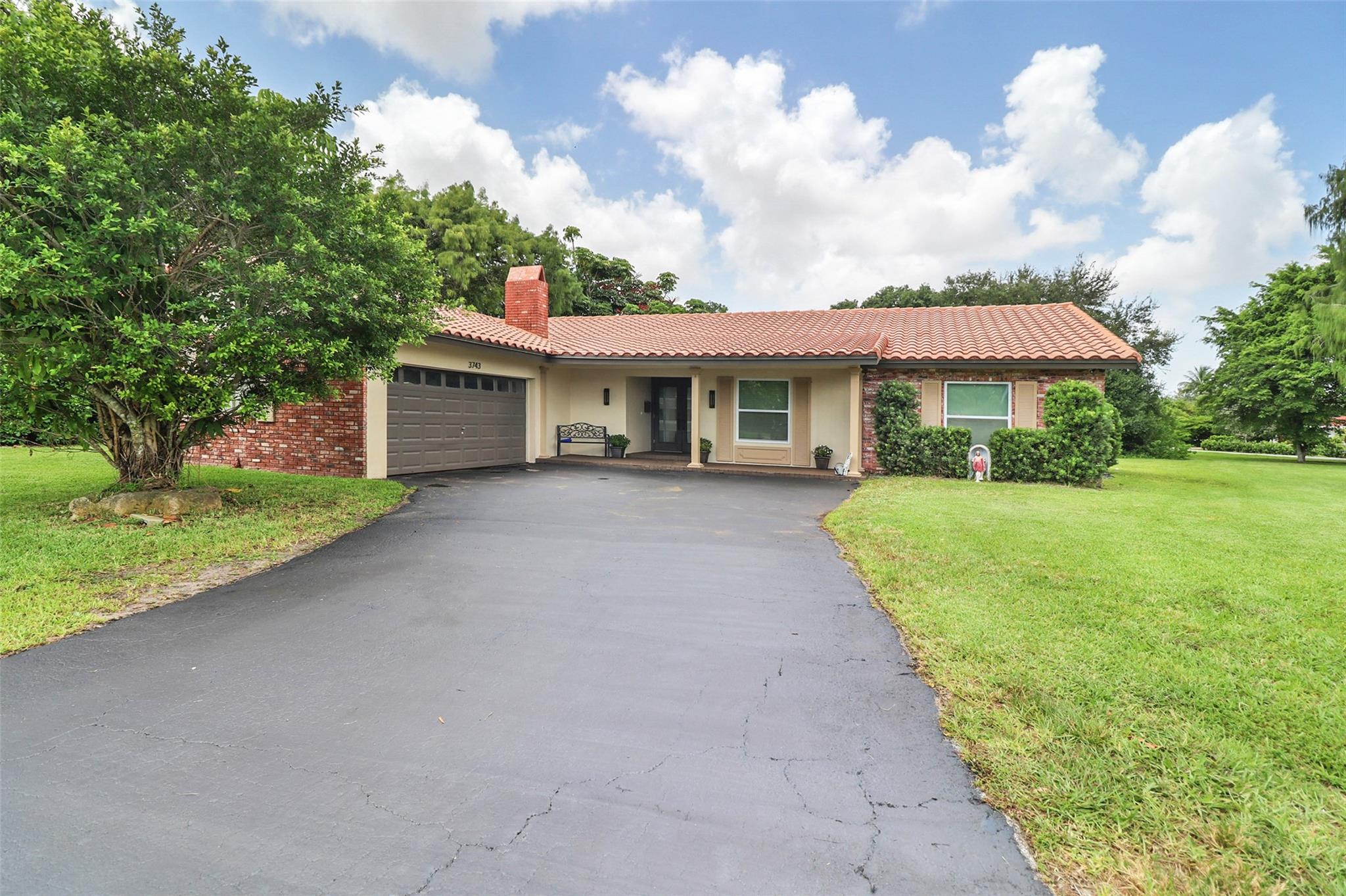 Highly desirable NO HOA community in "The Clusters" at Coral Springs... very nice 4 bedroom, 2 bath, large screened in pool home with paver deck, situated on over a half acre lot and located on a cul-de-sac. Recently updated kitchen and baths. Nice working wood-burning fireplace. Large outside screened in patio. Newer A/C, roof app 15 years. Outside electrical panel recently upgraded, new dishwasher and newer refrigerator. Tile throughout, crown moulding. Partial storm windows and doors. Large driveway to accommodate many vehicles. Close to everything Coral springs has to offer: great schools, hospital, many parks, shopping, restaurants, mall, and more...