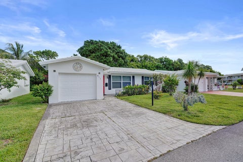 Photo of 411 NW 26th Court, Pompano Beach, FL 33064 (MLS # B26038909)