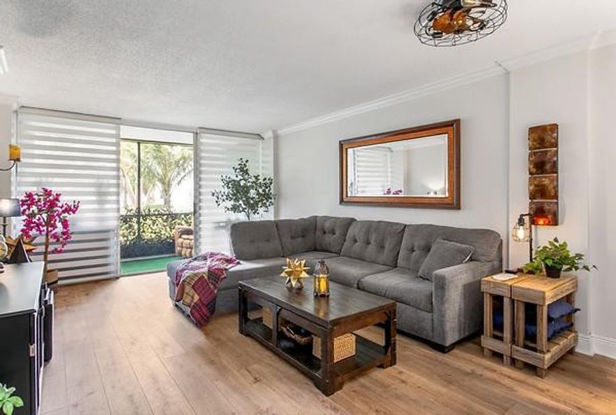 Welcome to Royal Park.  A Guard Gated Community offers 3 pools and a community Center with Fitness Room.  This Tastefully updated first floor unit offers Impact Windows and Front Door, and accordian shutters on the sliders to the screened in Patio.  The Patio overlooks Royal Park's green space and gardens and is in close Proximity to one of the association pools. Walk to Easterlin Park.  This is a Pet friendly complex which allows two pets of any size.  Come Fall in Love with the updates and Style this Unit offers.  Beautiful Kitchen with Stainless appliances.  Updated Primary Bath with tile floors.   Newer washable vinyl flooring in kitchen and living area.  Dont miss out on this opportunity to own a move in ready unit that is priced to sell.