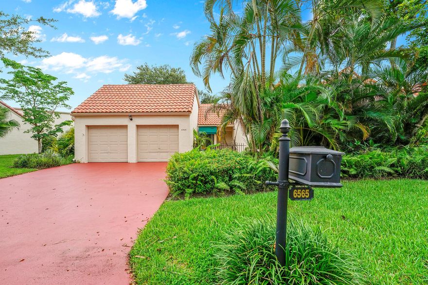 Welcome to this rarely available single-level corner unit offering three bedrooms, two bathrooms, a private two-car garage, and peaceful lakefront views. With nearly 2,100 square feet under air, this residence features a bright, open layout with soaring ceilings, abundant natural light, and a private patio overlooking the lake, creating the perfect setting for relaxing or entertaining. Inside, you'll find a completely remodeled modern kitchen, 18-inch ceramic tile throughout the main living areas, newer porcelain tile in the primary suite, and updated laminate flooring in both guest bedrooms. The spacious primary bedroom includes a walk-in closet, a soaking tub, and a separate shower, all with serene water views right outside your window. A newer washer and dryer add to the move-in-ready appeal. 

L'Ambiance is a beautifully maintained, neighbor-friendly community featuring two pools, tennis courts, and an active HOA that covers landscaping, pool maintenance, and all common areas. Perfectly located in Central Boca, you are just minutes from Town Center Mall, A-rated schools, shopping, dining, houses of worship, and have convenient access to both I-95 and the Turnpike. This property delivers the ideal combination of comfort, lifestyle, and location.