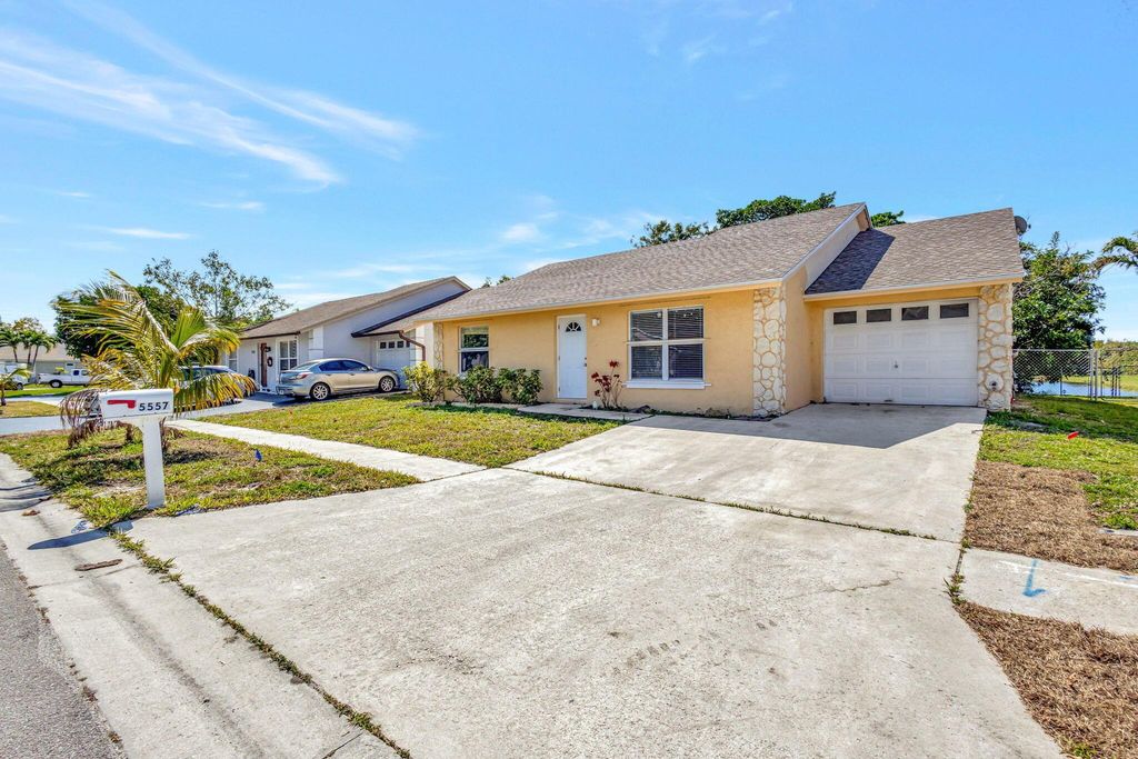 Photo of 5557 Priscilla Lane, Lake Worth, FL 33463 (MLS # R11074682)