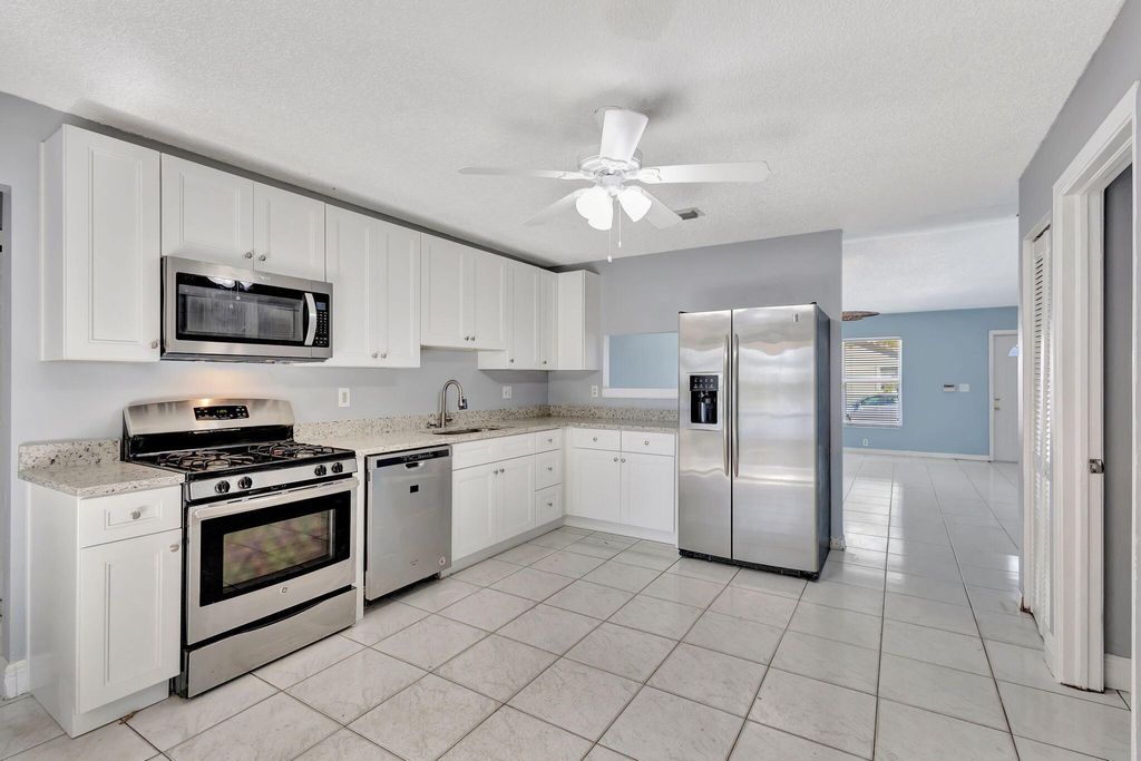 Photo of 5557 Priscilla Lane, Lake Worth, FL 33463 (MLS # R11074682)