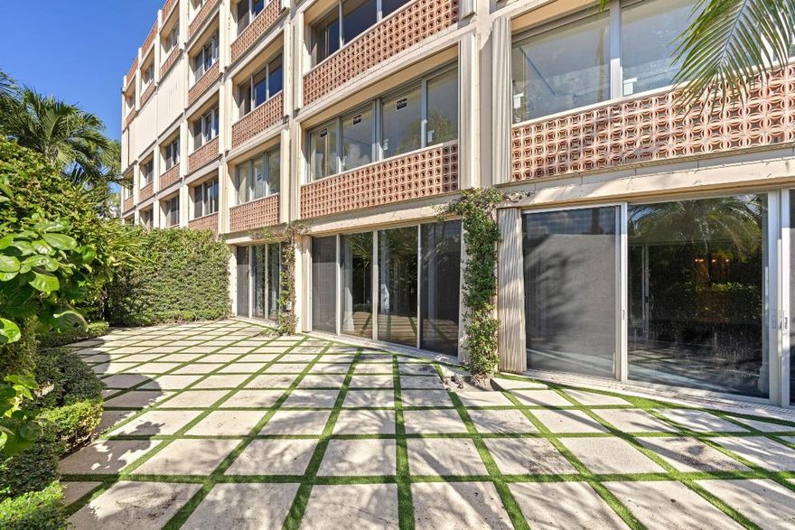 This elegant CO-OP offers classic Palm Beach living, ideally located steps from the new town marina, park, and Worth Avenue. This rare ground-floor 2BR/2BA offers a split layout and an exceptional 1,500± SF private terrace for seamless indoor-outdoor living, in one of the few buildings welcoming dogs of any size. A gracious foyer leads to a sun-filled living room, while the serene primary suite includes an en-suite bath and ample closets. Updated throughout with custom built-ins, timeless moldings, and refinished hardwood floors. Park Place provides full-service living with a 24/7 doorman, resort-style pool, attentive staff, and a prime walkable location near dining, shopping, and The Four Arts.