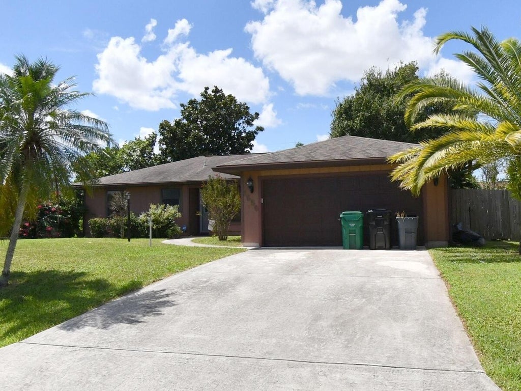 Photo of 1656 SW NORMAN Lane, Port Saint Lucie, FL 34984 (MLS # B26081545)