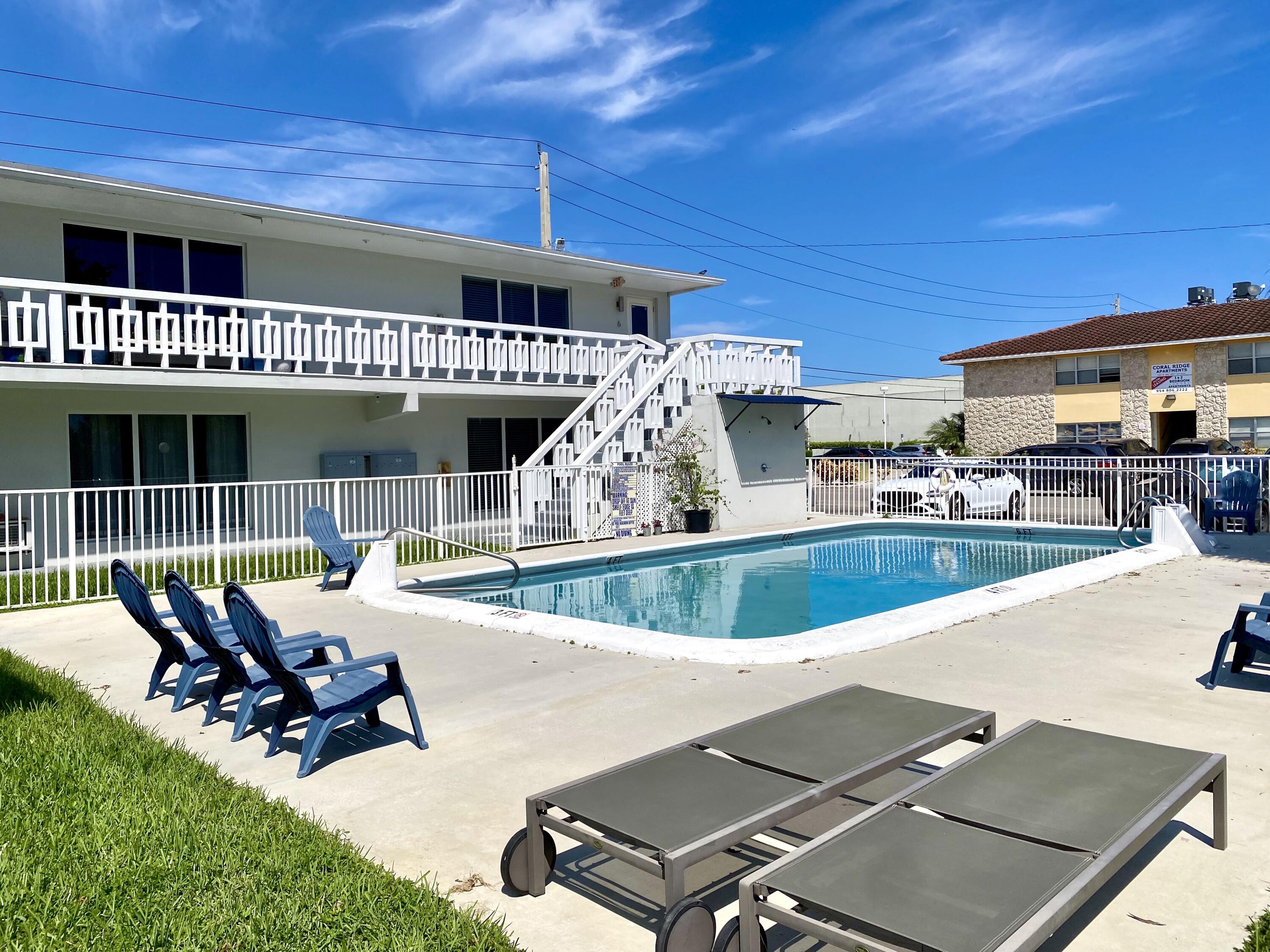 Great location in Coral Ridge! No-HOA and fast approval! JUST 5 MINUTES TO THE BEACH, east of US-1, next to Coral Ridge Country Club, Lauderdale-by-the-Sea beach and many restaurants! Second floor corner 1 bed/1 bath unit has been completely renovated - NEW kitchen, bath, floors, fixtures. Good closet space with walk-in closet in bedroom. Located in a quiet small apartment complex with its own sparkling community pool and lounge chairs for relaxing outside! 1 designated parking spot + guest parking available. Pets OK. Easy coin-laundry in the building. Water INCLUDED in rent. Tenant pays electric/cable. I will have 2 other identical 1B/1B units available here as well - one on first floor and one on second floor.
