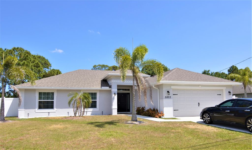 Photo of 5803 NW Basswood Drive, Port Saint Lucie, FL 34986 (MLS # R11160033)