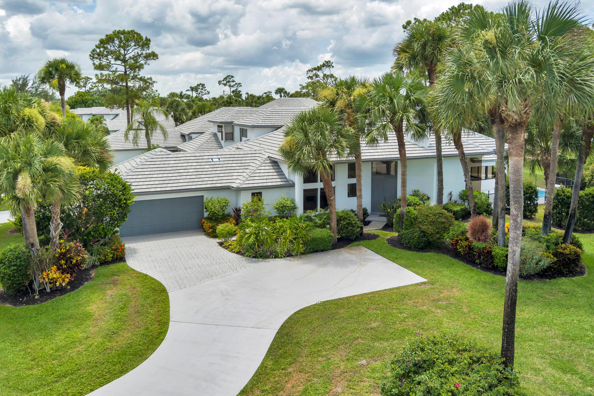 Fully renovated turn-key corner unit in Sand Drift Villas of Breakers West. Exterior building insurance and roof maintenance included in HOA. Large 48' Padron flooring tile, high ceilings, ample natural light and picturesque views of new pool give this home a fresh and spacious ambience. Complete with high quality kitchen cabinets, new appliances and luxurious bathrooms. Newly resurfaced pool with marble decking and separate private courtyard off secondary bedrooms. Roof, gutters & exterior painting done in 2023. Non-mandatory memberships available at Breakers West, Breakers Palm Beach and Mayacoo Lakes Country Club. 20 min to downtown WPB & Palm Beach Island. 15 min to Palm Beach International Airport and Wellington Equestrian area