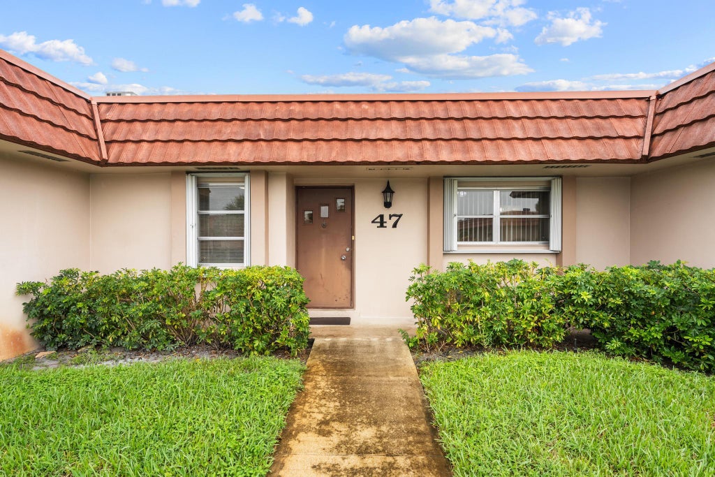 Photo of 5725 FERNLEY Drive E #47, West Palm Beach, FL 33415 (MLS # B26071194)