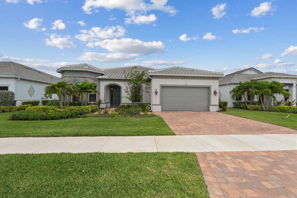 Photo of 10799 STELLAR Circle, Palm Beach Gardens, FL 33412 (MLS # B26059942)
