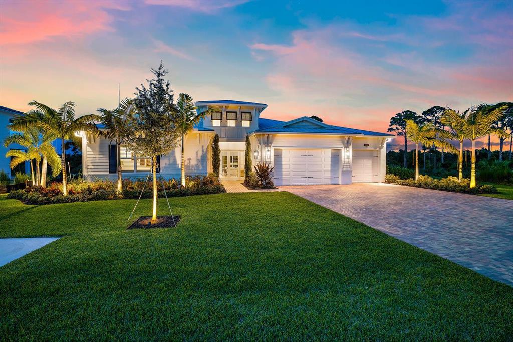 Stunningly designed and appointed one story home in the gated premier community of Prado in Jupiter in Martin Co. This home has been fully upgraded both before completion and after. Starting with the extremely private preserve lot on a wonderful quiet cul de sac. The towering entry welcomes you to this beautiful foyer which opens to expansive Great Room concept taking your eye directly outside to the crystal blue pool and natural preserve. 12-14ft ceilings in the main living areas and almost 11ft in the bedrooms. Designer 32 '' porcelain tile floors and wood plank styled in all bedrooms. The kitchen is a masterpiece with expanded Island and custom extra thick countertop. Wolf & Subzero appliances Throughout the home has upgraded cabinetry and closet build outs.