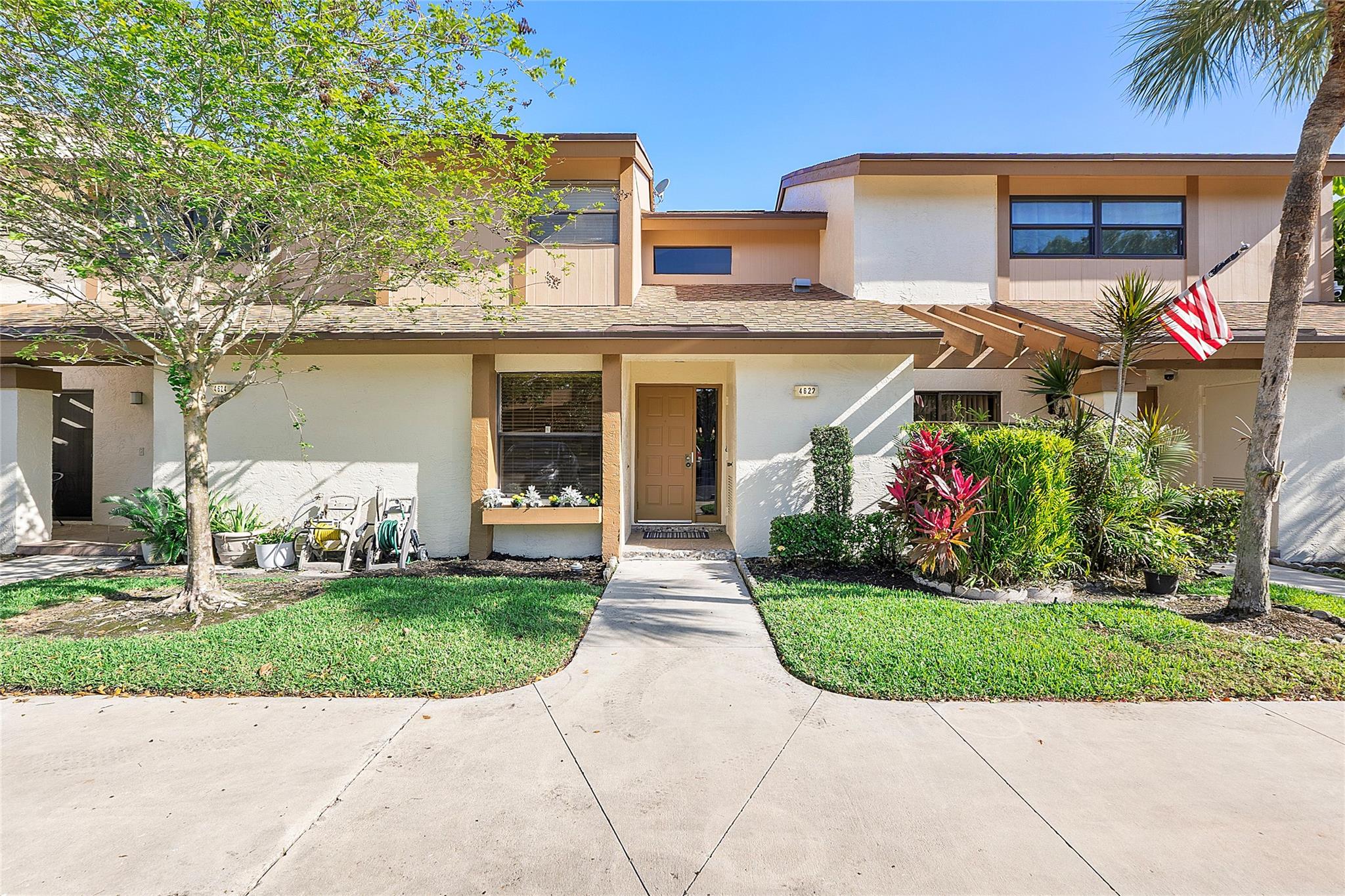 You will love this renovated, move in ready, 3 bedroom 2 and a half bath townhome located in Coconut Creek. It boasts vaulted ceilings with an open, airy floor plan, featuring a large family room, and pass thru kitchen to the dining area. Convenience meets functionality with a bedroom located on the first floor that's ideal for guests, or an office. Lots of light illuminates the space accentuating the fresh, modern design. Enjoy the screened in patio where you can savor the beautiful garden views and comfortable evenings pest free. As part of The Township, you’ll have access to community amenities, including pools, tennis courts, and clubhouse. The Golden Raintree community is centrally located to shopping, dining and major roadways. Don’t miss this opportunity to make it your own!