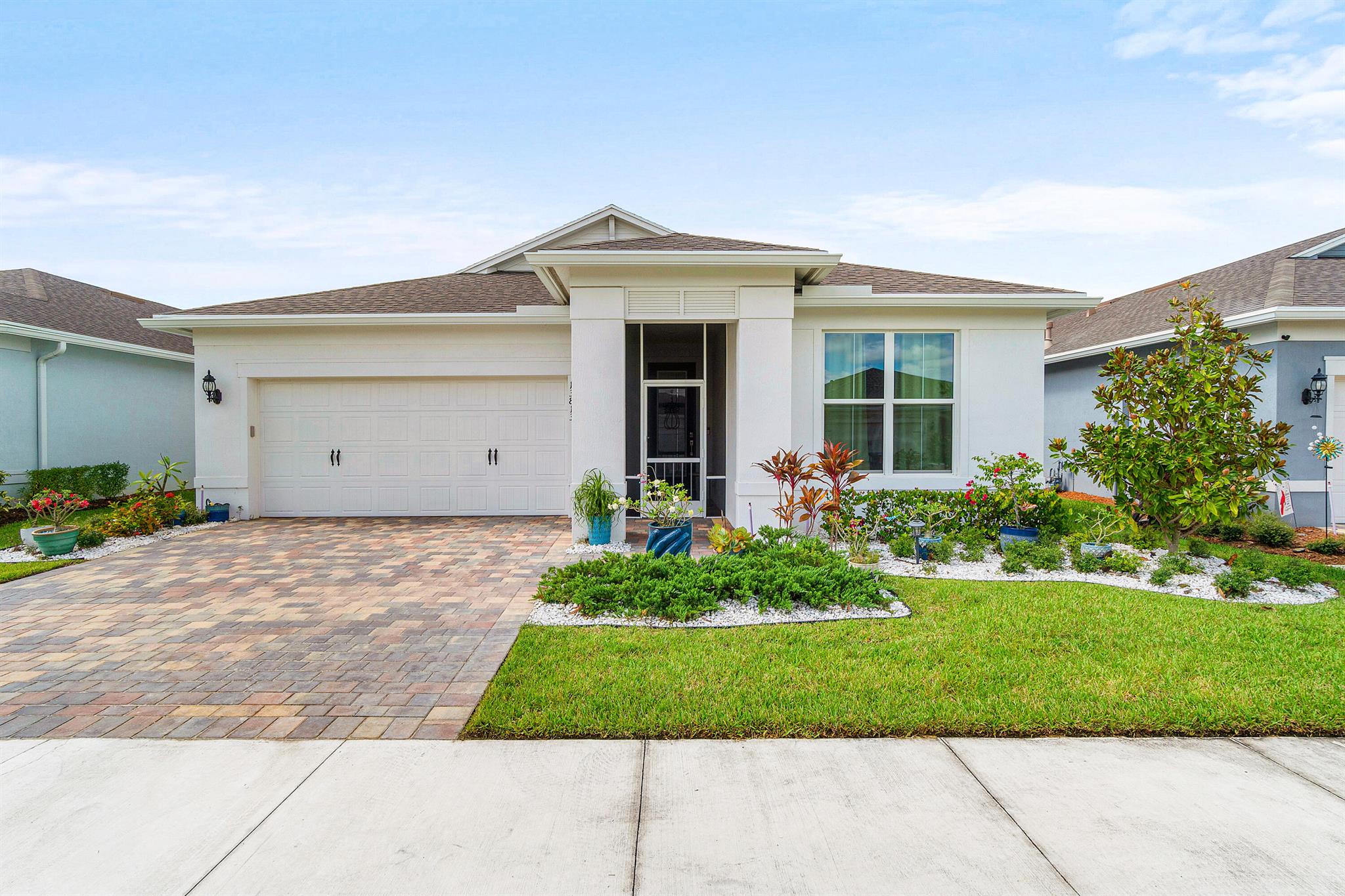 *** Mortgage savings may be available for buyers of this listing ***Welcome to this beautifully designed 2-bedroom, 2-bath home in the heart of Port St. Lucie. Built in 2024, this residence combines modern features with everyday convenience, offering both comfort and style.Inside, you'll find a spacious layout with tile flooring throughout, a kitchen pantry with custom shelving, and thoughtfully designed custom closets in the primary bedroom. The home is equipped with impact-resistant windows for peace of mind and a two-car garage for added functionality.Step outside to a fenced backyard, perfect for outdoor gatherings, relaxation, or enjoying a bit of privacy.Living here means more than just a beautiful home. The community provides an impressive range of amenities