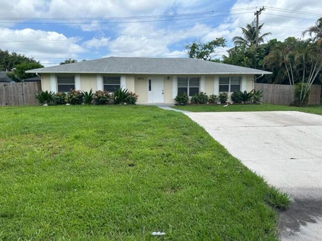 Photo of 9073 Lantern Drive, Lake Worth Beach, FL 33467 (MLS # R10895333)