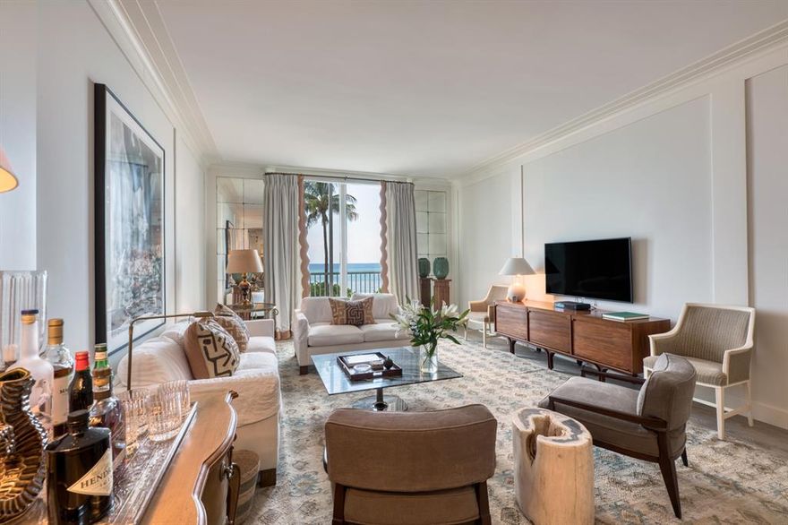 Direct ocean views, a pristine renovation and a Modernist masterpiece of an in-town building. In 2019, a London-based interior designer rethought every square inch of this duplex apartment. High end finishes and luxury fixtures abound. Hardwood floors, a gorgeous kitchen with Portuguese tiled backsplashes and premium appliances, pristine new bathrooms, 10' high living room ceilings, full impact glass, large new closets in the master bedroom, storage under the rebuilt internal stairs and built-ins everywhere. 2 bedrooms, 2 baths and a beautiful powder room, full size washer/dryer and the building has 5 inexpensive guest suites for your overflow visitors. 2019 Renovation included all new wiring, plumbing, AC and flooring.  
Kitchen appliances are Wolf, Bosch and SubZero and unit has a full home dehumidifier system.

The 400 Building also has a rooftop social room with full catering kitchen along with outdoor gas grills available for owners use.  One assigned underground parking spot, 2nd spots are made available via a lottery.