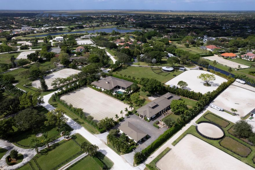 Beautiful 12 stall center aisle barn with: 3 wash stalls, 2 grooming stalls, 2 tack rooms, laundry & feed rooms, 6 paddocks, fantastic 225'X 120' Discount Dirt Works Arena & 6 paddocks. For lease: up to 5 stalls at $2100 per month per stall.