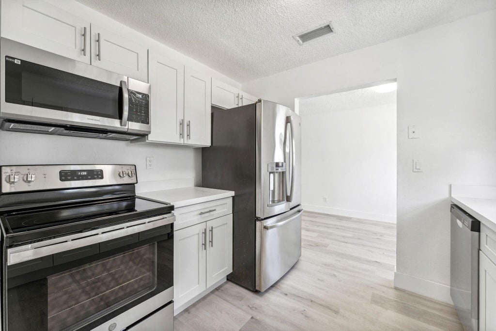 Photo of 514 NW 3rd Way, Deerfield Beach, FL 33441 (MLS # R11092806)
