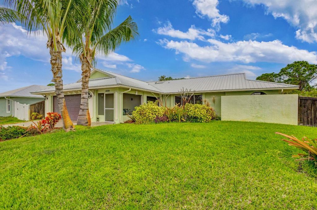 Photo of 1409 SW Aachen Avenue, Port Saint Lucie, FL 34953 (MLS # R10953011)