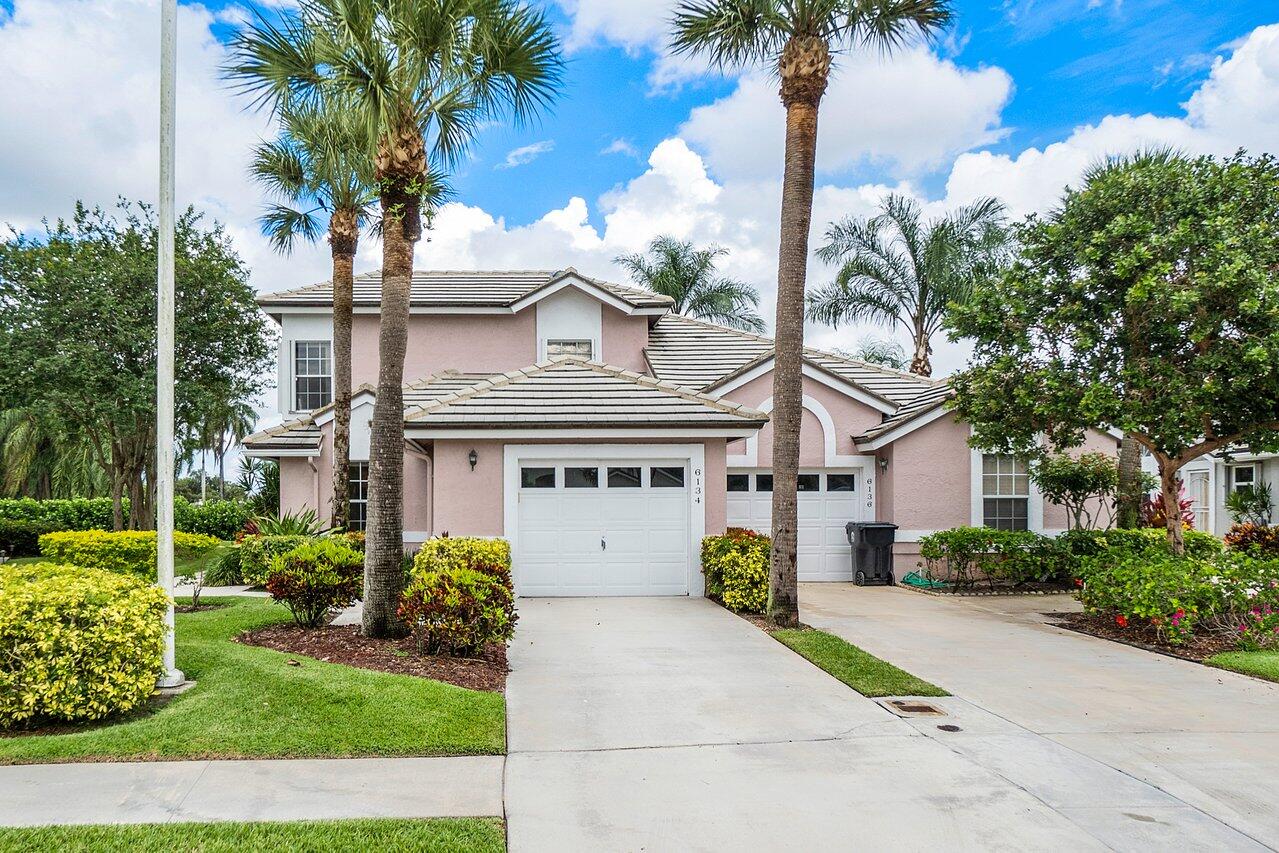 RESORT STYLE LIVING. Amazing views of the golf course and water from your living room and first floor bedroom. Split Floor Plan. If you enjoy golf, you will be in paradise. GARAGE PLUS GOLF CART STORAGE! NO MEMBERSHIP FEES. Split Bedrooms, Newer Appliances,BRAND NEW AC Unit Soft Close Cabinets and Drawers, New Carpet, Accordion Shutters. Gated community (manned gate) includes Golf Course, Clubhouse, Fitness Center, Pool, Tot Lot, Restaurant in Community, Walking Path around Golf Course and much more! Pets Ok. BASIC CABLE INCLUDED.