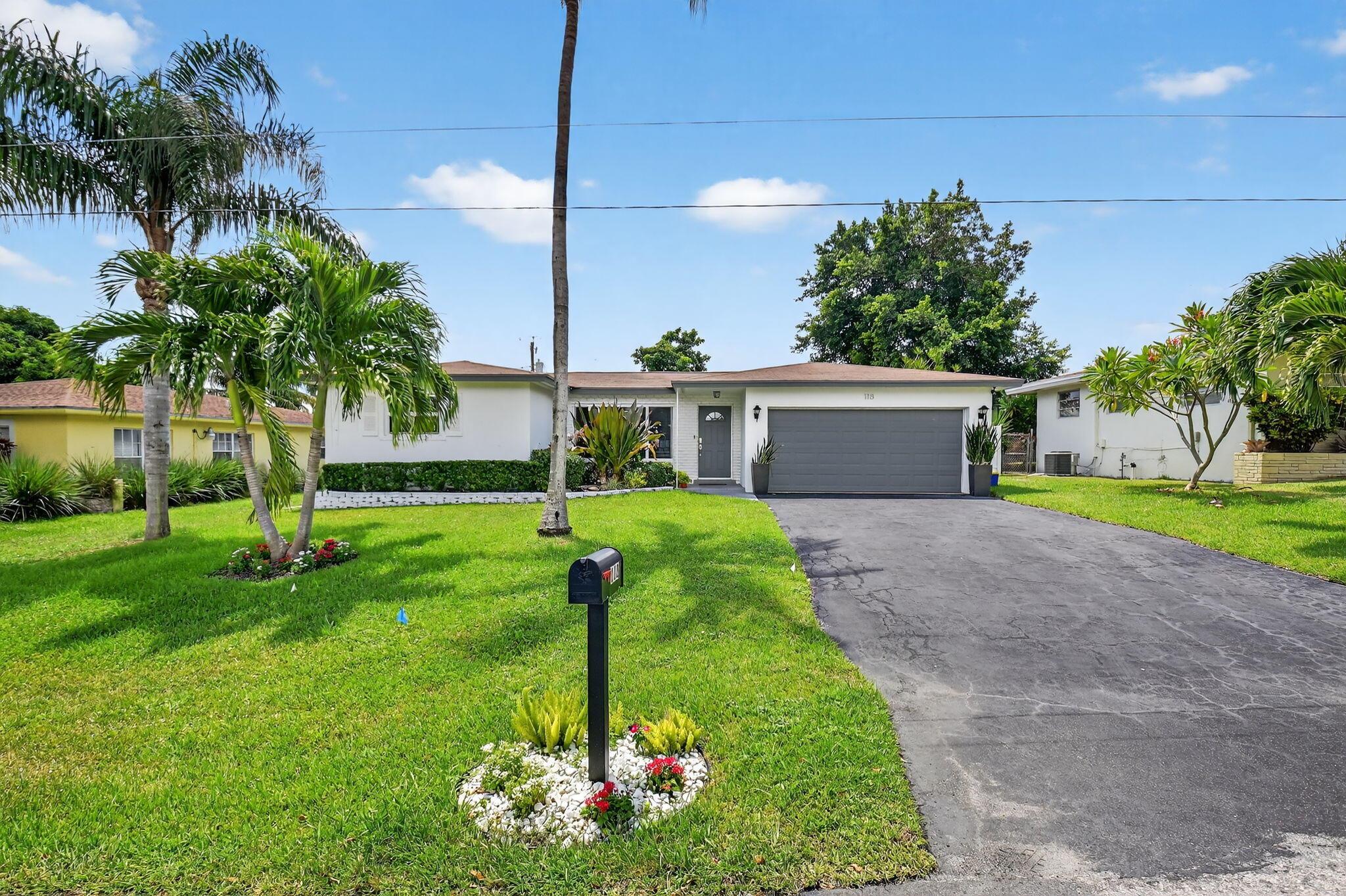 Experience the best of coastal living in this beautifully upgraded 3-bedroom, 2-bath pool home located in a quiet, non-HOA neighborhood of East Boynton Beach. Just 2.5 miles from vibrant Downtown Delray and only minutes to pristine beaches, this residence offers both lifestyle and investment potential. Recent enhancements include full impact windows, a new flat roof, new appliances, and a newly paved driveway. Inside, an open-concept layout welcomes you with abundant natural light, expansive pool views, and a stunning kitchen featuring a large island and plentiful cabinetry. All bedrooms are generously sized with new laminate flooring and fresh paint. The backyard oasis showcases a sparkling pool, paver patio, and private deck perfect for entertaining or relaxation.