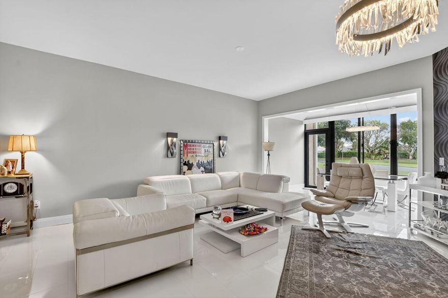 Live the Boca lifestyle in a designer-renovated 2 bedroom, 2 bath residence in La Paz at Boca Pointe, an all-ages, guard-gated community with rare optional country club membership. This ground-floor corner unit offers 1,636 total square feet, including the Florida room and lanai. No stairs. No elevators. A split floor plan designed for ease and privacy. Designer finishes set this home apart. The dining area opens to a glass-enclosed Florida room with direct walkout access and tranquil pond and garden views. The kitchen makes a bold statement with white high-gloss cabinetry, quartz leather countertops, a dramatic backlit stone geode pass-through, and premium Samsung appliances. The kitchen and primary bedroom both open to a screened lanai, extending the living space outdoors. Porcelain til Live the Boca lifestyle in a designer-renovated 2 bedroom, 2 bath residence in La Paz at Boca Pointe, an all-ages, guard-gated community with rare optional country club membership. This ground-floor corner unit offers 1,636 total square feet, including the Florida room and lanai. No stairs. No elevators. A split floor plan designed for ease and privacy. Designer finishes set this home apart. The dining area opens to a glass-enclosed Florida room with direct walkout access and tranquil pond and garden views. The kitchen makes a bold statement with white high-gloss cabinetry, quartz leather countertops, a dramatic backlit stone geode pass-through, and premium Samsung appliances. The kitchen and primary bedroom both open to a screened lanai, extending the living space outdoors. Porcelain tile flooring flows throughout. Motorized blinds elevate the main living areas. Blackout blinds enhance the bedrooms. Full impact glass windows deliver efficiency and comfort while framing lush views. The primary suite is a private retreat featuring a spa-style bath with a jetted soaking tub, frameless walk-in shower with waterfall shower head, double vanity, and a custom California walk-in closet with built-in storage. The guest bedroom sits beside a sleek designer bath with a contemporary stall shower, ideal for guests or a refined home office. Additional upgrades include storm shutters, an in-unit Samsung washer and dryer, assigned parking, and extra storage. Residents enjoy two resort-style pools, tennis courts, a clubhouse, and scenic walking paths. Optional Boca Pointe Country Club membership offers golf, pickleball, padel, tennis, fitness, dining, and social opportunities Minutes from Boca Raton beaches, shopping, dining, major highways, and top-rated schools. 7535 La Paz Boulevard, Unit 105, Boca Raton, FL Furnishings available. *Some photos virtually staged.
Schedule your private tour and experience elevated Boca Pointe living.