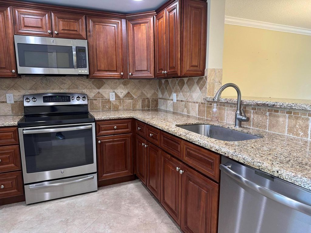 Photo of 300 John F Kennedy Drive #402, Atlantis, FL 33462 (MLS # R11040793)