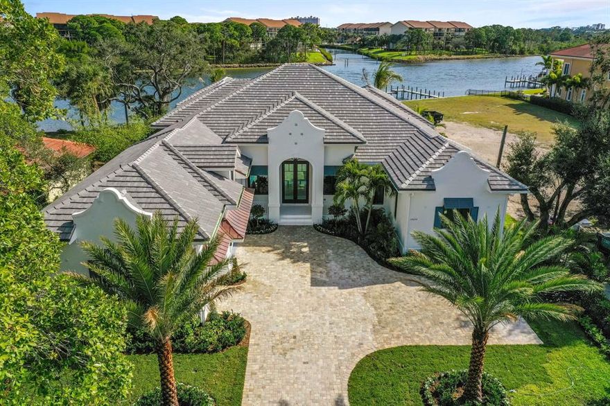 DIRECT INTRACOASTAL beautiful new 5 bedroom plus club room Dutch West Indies home. Completed Jan 2019. TRANSITIONAL open floor plan perfect for entertaining, 5,293 sq ft under air. Interior features oak tongue and groove flooring in living areas, ceiling details include, coffer, volume, tray and beam applied moldings, impact windows and doors. Gourmet kitchen with quartz countertops and Mosaic tile backsplash, two islands, all Thermador appliances, and large concealed pantry. Wet bar with granite top, sink, refrigerator, and wine refrigerators. Master suite has applied wood molding, great view and fabulous bath retreat with separate his and her commodes, free standing tub, quartz slab vanities, White Diamond stone, shower walls and floors including mosaic. Family room disappearing doors open to expansive cypress covered loggia summer kitchen with grill, sink and fridge. Sparkling spa and infinity pool with sun shelves leads to ICW, private dock with 2 boat lifts. Exceptional location in Palm Beach Gardens  near shopping & restaurants  PGA corridor by car or boat! The home is minutes away from secluded beaches of Juno & Jupiter & the Jupiter and Palm Beach Inlets.