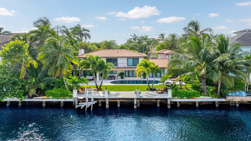 4304 Intracoastal Dr offers an unparalleled opportunity on the direct Intracoastal in South Florida representing incredible value. Nestled in the prestigious Bel Lido enclave of Highland Beach, this property offers the choice to embrace its charm or envision a new masterpiece. With 95 feet of waterfrontage and private beach access, enjoy breathtaking views and a tranquil lifestyle. The main residence features a generous primary suite with an expansive walk-in closet, three elegantly appointed guest bedrooms, and an attached guest house ideal for visitors. The outdoor oasis showcases a pool and spa surrounded by lush landscaping. With its charming architecture that blends elegance and coastal allure, this property promises a luxurious lifestyle making it a true gem in Florida's paradise.