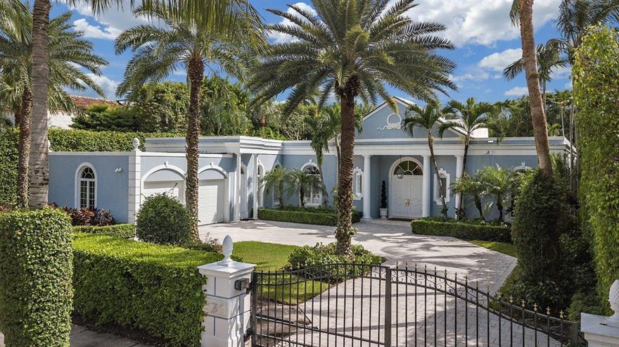 ''La Perla'', a premier gated estate, boasting high ceilings, gracious room proportions, lush landscaping, all on a private oversized lot. Incredible outdoor entertainment flow with two spacious covered lanais (providing additional 1092 square feet), an inviting 50'x20' pool, and separate Cabana/Guest Suite. Professional design and decor by Scott Snyder.