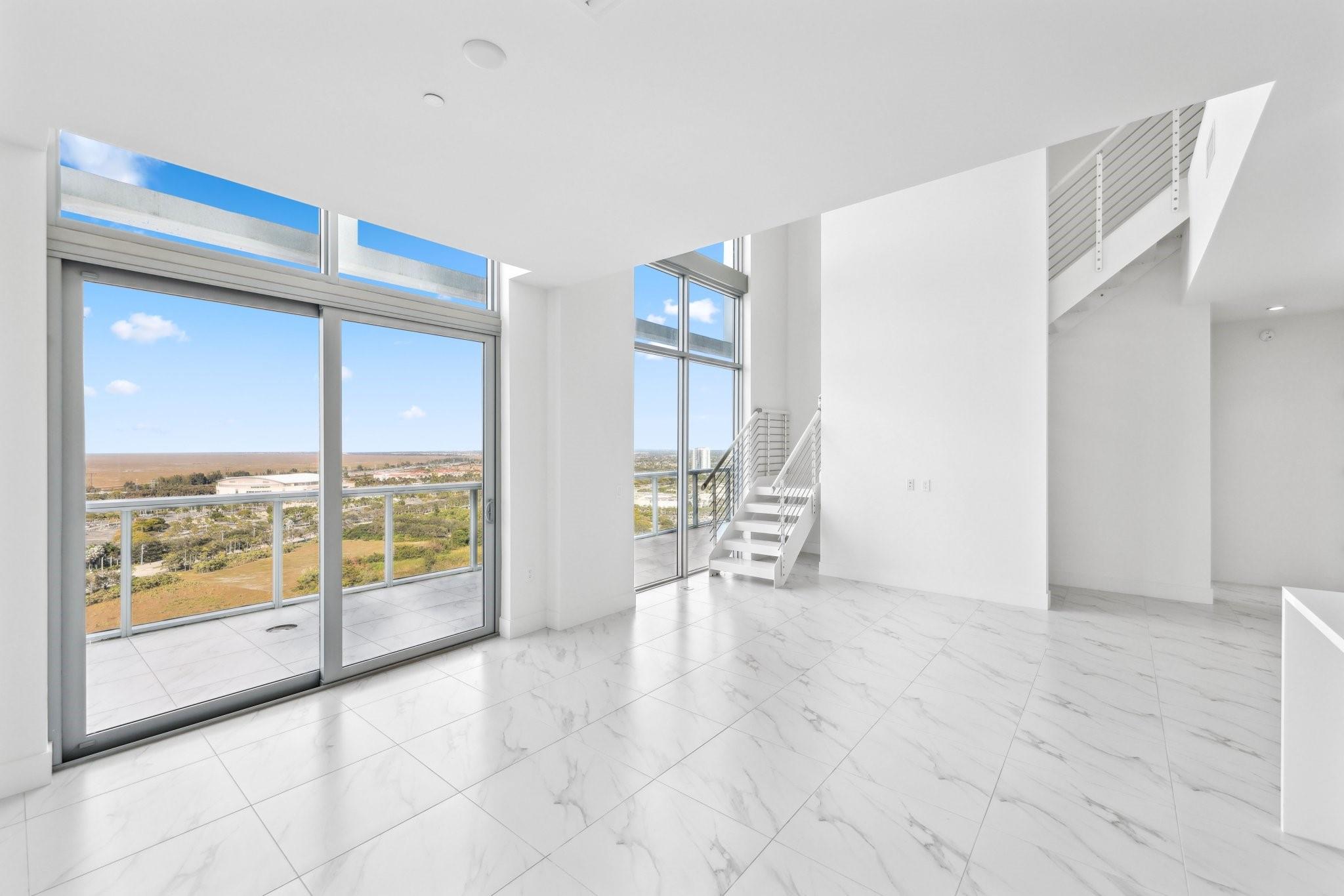 Experience modern elegance in this two-story penthouse at Metropica, offering floor-to-ceiling windows, open living spaces and an expansive private terrace with breathtaking views. Designed for sophistication, each residence features high-end finishes, European-style cabinetry, quartz countertops and premium appliances. The primary suite boasts a spa-inspired bath, dual vanities and a soaking tub, with additional rooms for guests or office space. Be the first to call this stunning, new penthouse home! Enjoy resort-style amenities, including a pool, fitness center, sauna, clubhouse, tennis courts, kids playroom and 24/7 security. Steps from Sawgrass Mills Mall, Amerant Arena, restaurants and major highways. Choose from four different penthouse floor plans. ASK ABOUT THE 5% DEVELOPER CREDIT!