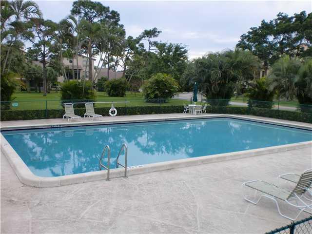 Lovely, spacious and bright, rarely available 3/2 1st floor corner unit overlooking the golf course. Newer kitchen w. granite counter tops, SS appliances, spacious split bedroom plan, beautiful hardwood floors in bedrooms. Impact French door leading to large patio on beautiful golf course. The Seagate at the Hamlet is a great community includes a 24 hrs. guarded entrance, heated community pool and clubhouse facilities. Covered parking, basic cable and water are included. Just minutes to Delray's beautiful beaches and fine restaurants, bistros, 95 and trendy shops of Downtown Atlantic Avenue!