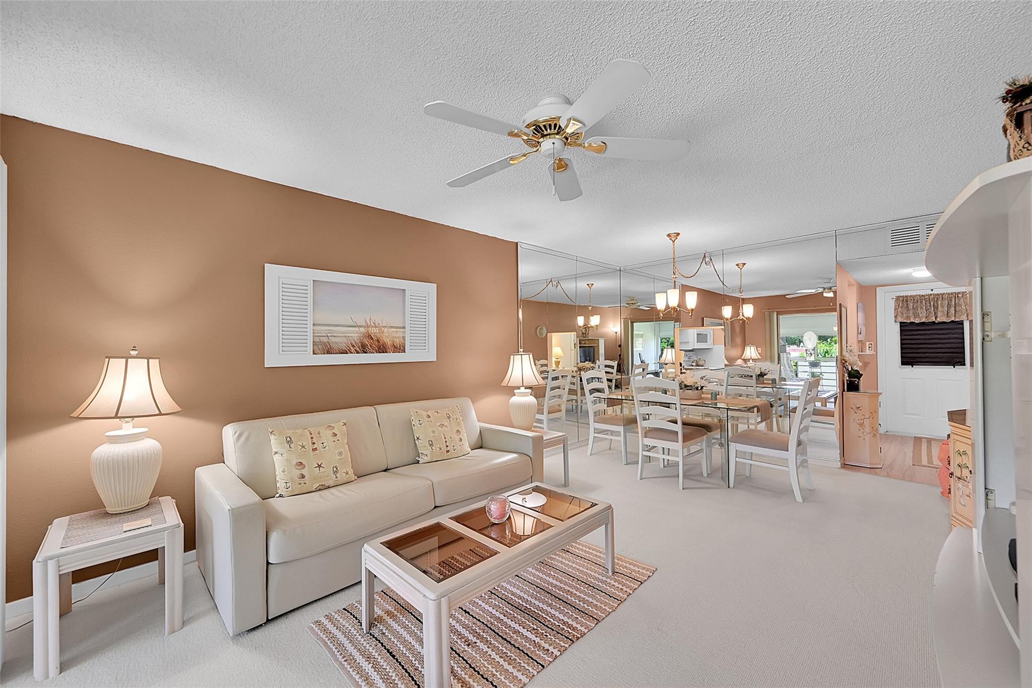 Charming 1BR/1BA condo in Natura, a vibrant 55+ community in Deerfield Beach. Priced under assessed value! Features impact windows and front door, 2023 carpet, 2-ton A/C (2016), and water heater (2022). Enjoy serene garden and pool views from the spacious screened patio with roll-down shutters. Community offers a clubhouse, heated pool, fitness center, BBQ area, shuffleboard, bike room & more. LOW HOA includes cable, water & sewer. 40-year recertification complete. Prime location near beach, dining & I-95! Priced to sell! Bring OFFERS!!