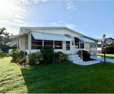 Photo of 8204 W BITTERBUSH Lane, Port Saint Lucie, FL 34952 (MLS # B26054287)