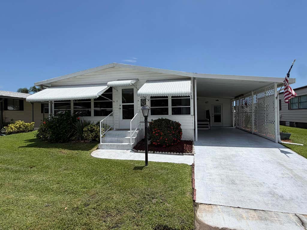 Photo of 8204 W BITTERBUSH Lane, Port Saint Lucie, FL 34952 (MLS # B26054287)