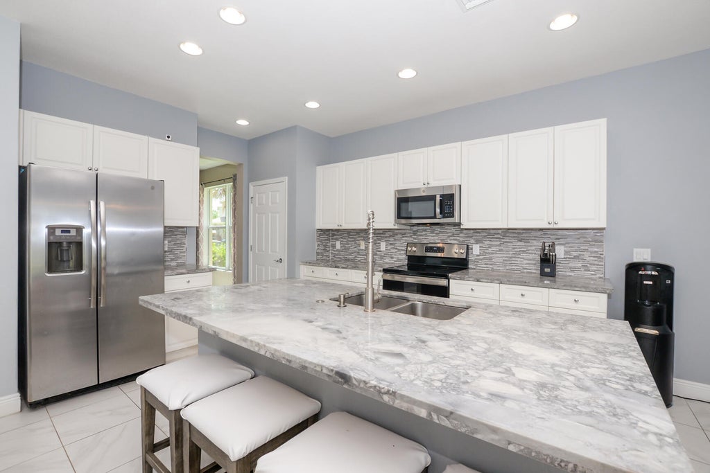 Photo of 1327 NW Leonardo Circle, Port Saint Lucie, FL 34986 (MLS # R10983717)