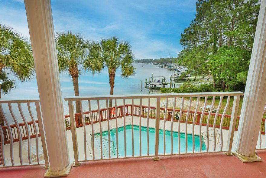 Welcome to this beautifully renovated 1-bedroom, 1.5-bathroom two-story condo offering breathtaking views of Cinco Bayou from private balconies on both floors. This spacious unit combines modern upgrades with unique architectural charm, making it perfect for full-time living, a vacation getaway, or investment opportunity.  The completely updated interior features an open and inviting layout with luxury finishes throughout. The kitchen has been fully remodeled with granite countertops, all-new appliances, a large stainless steel single-basin sink, and plenty of space for cooking and entertaining guests.  Both bathrooms have been tastefully upgraded with granite countertops, new faucets, modern white sinks, and a relaxing Jacuzzi tub with jets.  The private upstairs bedroom retreat features durable LVP flooring and a brand-new 72" brushed chrome ceiling fan with remote control for added comfort and style.  A striking updated black spiral staircase leads to the second-floor bedroom, adding character and sophistication to the space. Enjoy peaceful water views and fresh coastal air from both balconies while experiencing the perfect blend of comfort, style, and location.
